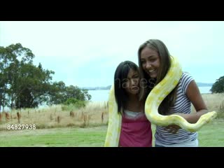 video ms two girls holding albino snake around shoulders standing sex